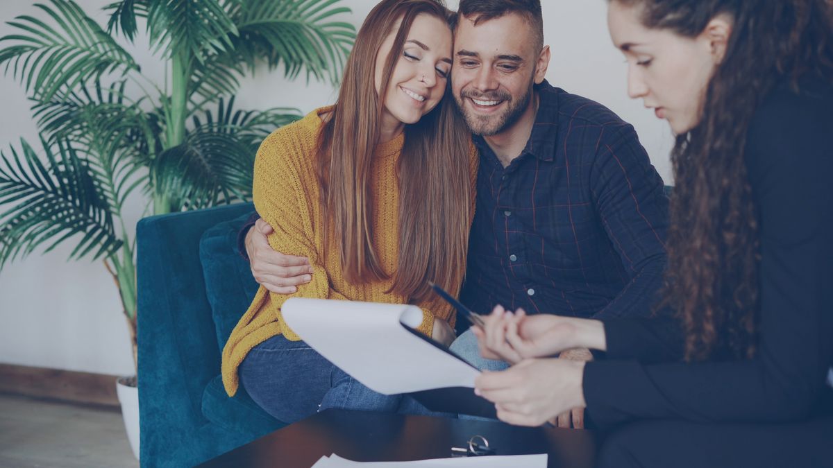 An insurance advisor speaks with a couple about their options