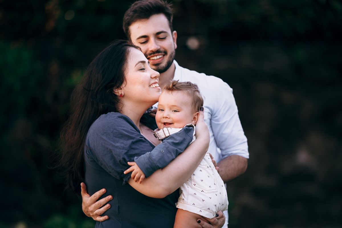 Family with their baby outdoors
